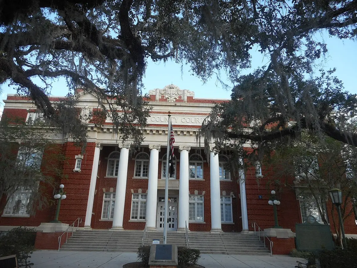 Hernando County, FL — An attempt to capture the columns, crest and other neo-classical features on the Hernando County Courthouse in Brooksville, Florida, that sadly is obstructed by many trees on the property. Even in Nov